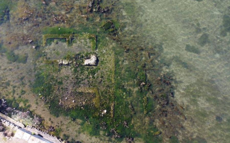 Aerial view of Lake Fusaro and the ruins of the Roman villa visible at the surface.
