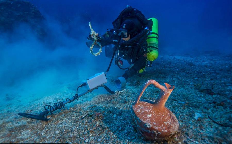 Metal detector survey of the shipwreck area, photo by Brett Seymour. 