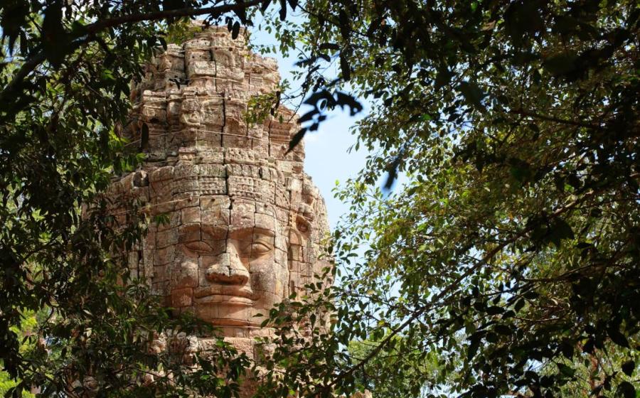Monumental stone face at Bayon Temple, Cambodia. 