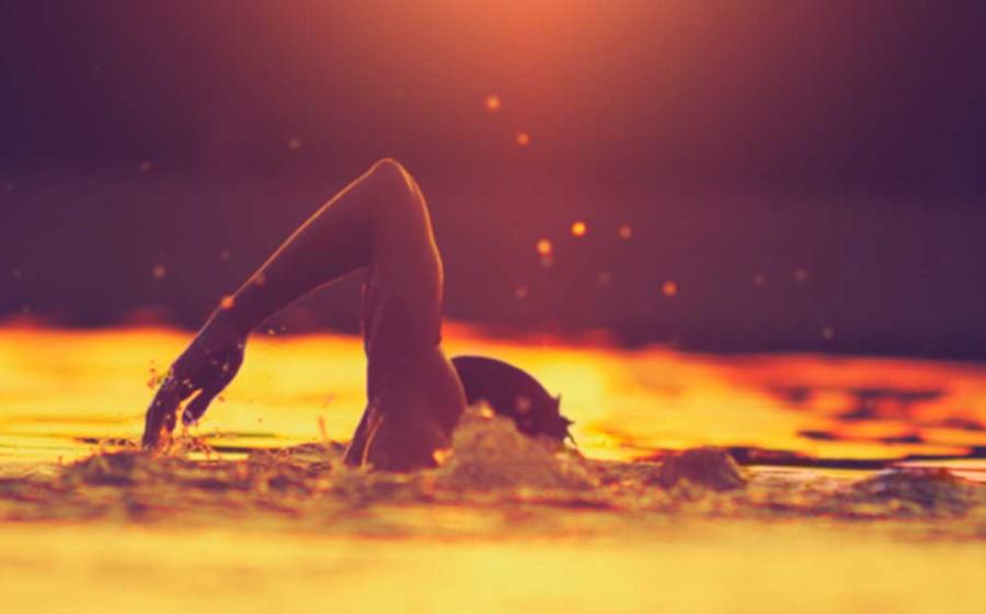 Swimmer in a lake, an activity dating back 100,000 years. Source: astrosystem/Adobe Stock