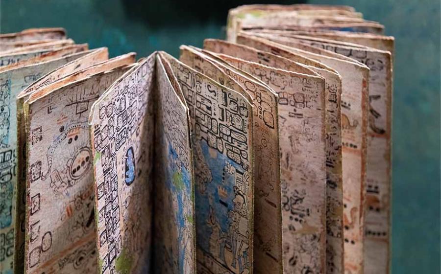 Mayan codex with hieroglyphic alphabet script writing system, Mexico City, Mexico. Source: SL-Photography / Adobe Stock.