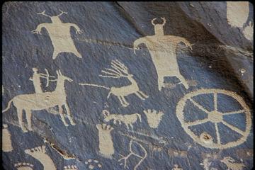 A petroglyph from Newspaper Rock, Utah, showing hunting with a bow and arrow.
