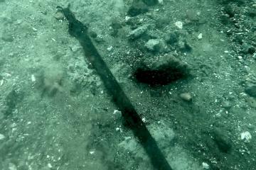 The 3,000-year-old bronze sword where it lay on the bed of Lake Mezzano 