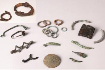 A set of small Gallic offerings and a pair of the Celtic iron shackles from Allonnes. 