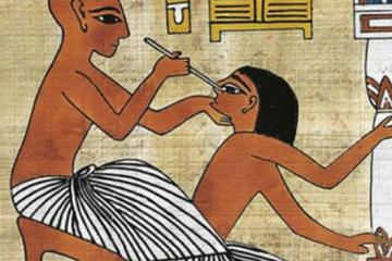 Egyptian fresco showing a doctor performing eye surgery