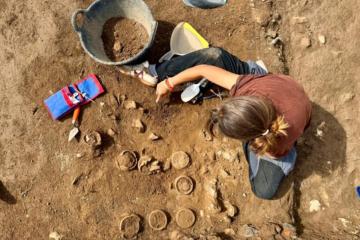 Archaeologist excavating ceramic pots at Hadrian's Villa.