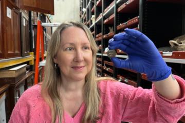 Kat Baxter, Leeds Museum and Galleries’ curator of archaeology and numismatics, shows the ancient coin.