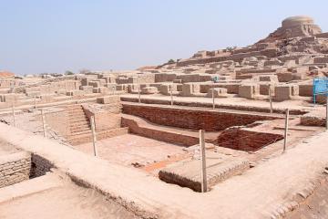 Excavated ruins of Mohenjo-daro, with the Great Bath in the foreground and the granary mound in the background