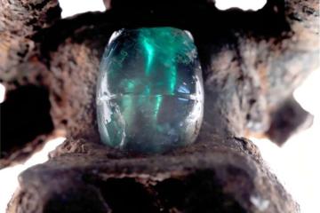An emerald mounted on a copper pendant recovered from a Coclé burial. 