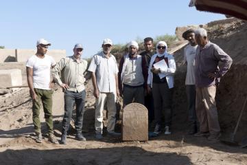 The Tiberius stele found at Karnak with some of the researchers on the project.