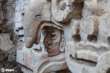 Close up of owl beak over a face above the entrance to the Zapotec tomb found in Mexico