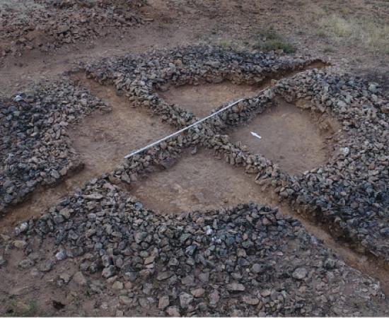 The remains of a kurgan burial mound found in Kazakhstan with two stone ridges known as "mustaches." 
