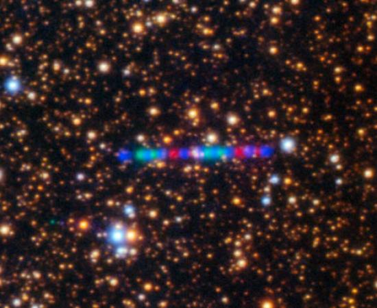 Image of 3I/ATLAS moving through the galaxy using color filters.