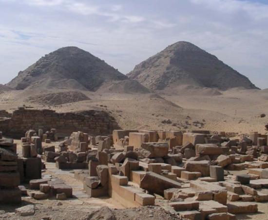 Abusir necropolis: Sahura Funerary Temple. Pyramids of Neferirkara-Kakai and Niuserra-Ini in the background.  Source: Public Domain