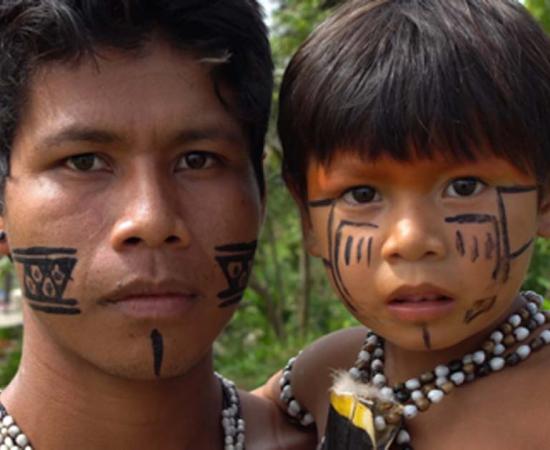 Indigenous father and son of the Amazon. Credit: gustavofrazao / Adobe Stock