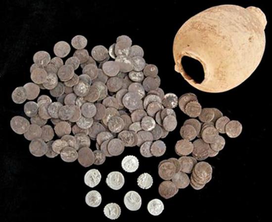 The Roman silver coins that were recently discovered in Ampurias, Spain and the amphora in which they were held. 