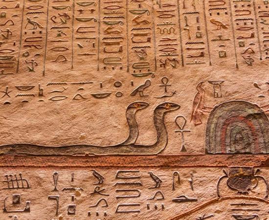 Egyptian painting of snakes near Anubis. Source: Vermeulen-Perdaen / Adobe Stock.