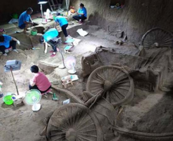 Archaeologists excavate the Zheng State No. 3 pit in Xinzheng city, Central China's Henan province, on July 12. (Image credit: VCG)