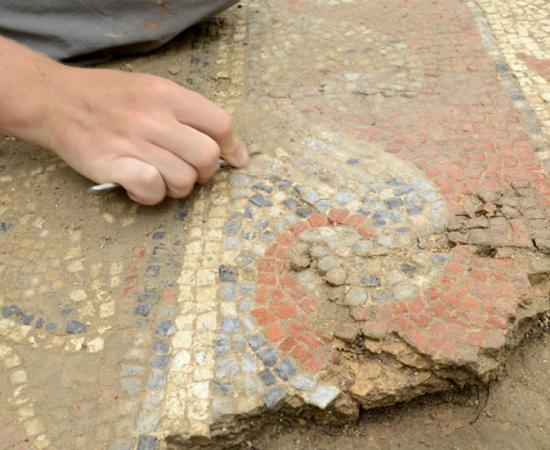 The site is being carefully excavated before the mosaics are removed.