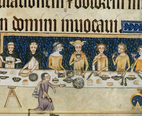 Sir Geoffrey Luttrell and his wife, Agnes Sutton entertaining. On the table are knives, spoons, dishes, and plates or trenchers of bread. (CC0)