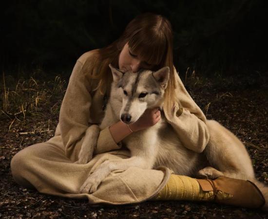 Woman with arctic dog. Source: Demian / Adobe Stock