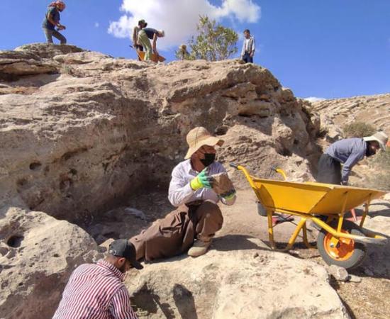 Excavators work at the site of the archaeological dig on the eastern bank of the Faidi canal, just north of Mosul, where evidence of an Assyrian wine press has been discovered. Source: The Kurdish-Italian Faida and Khinnis Archaeological Project