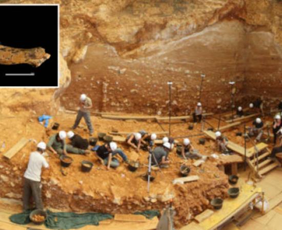 Gran Dolina archaeological site at Atapuerca, Spain, with inset child vertibra bone.