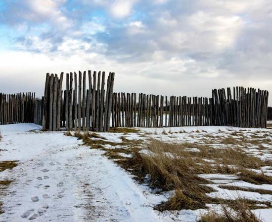 Fence surrounding the largest mound at Aztalan State Park. Source: Good Free Photos