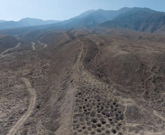 Aerial of the Band of Hole monument near Pisco, Peru.