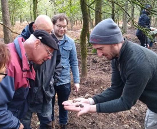 Dr Wouter Verschoof-van der Vaart with volunteers at one of the burial mounds identified during the project.