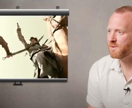 Medieval historian Matt Lewis reviews medieval battles scenes. Source: YouTube Screenshot / History Hit.