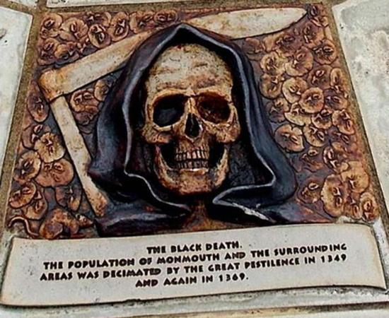 A plaque to the Black Death dead from 1349 and 1369 at Monmouth, Wales.		Source: Jaggery / CC BY-SA 2.0
