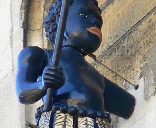 A closeup of the Blackboy statue in Stroud, England that may or may not be removed because it relates to English colonialism and racism.	Source: Brian Robert Marshall / Blackboy, Blackboy's School building, Stroud