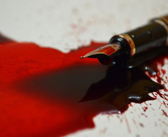 Pen with blood ink. Source: VJP / Adobe Stock