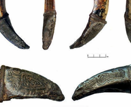 The medieval wild boar tusk amulet found in Veliky Novgorod.