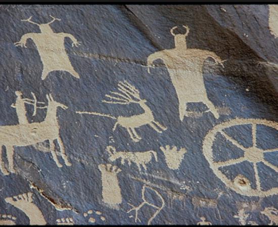 A petroglyph from Newspaper Rock, Utah, showing hunting with a bow and arrow.