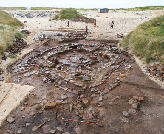 Eroding sand dunes revealed an archaeological site at the Links of Noltland on Westray, evidence of a settlement on Bronze Age Orkney. Source: EASE Archaeology