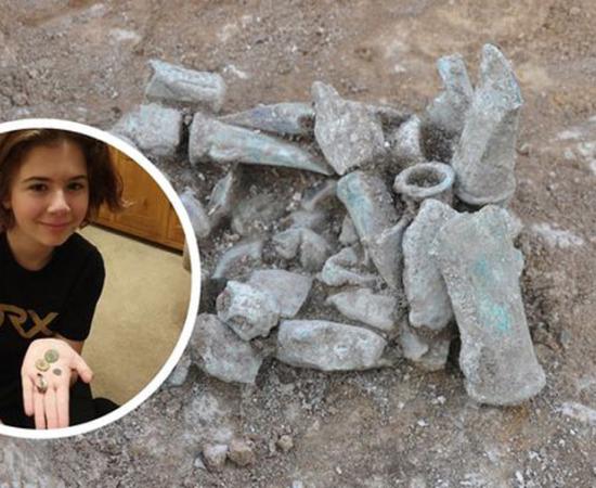 The Bronze Age hoard of axe heads and Milly Hardwick from a photograph by her mother Claire in the Royston Crow news.		Source: Claire Hardwick / Cambridgeshire County Council / Royston Crow