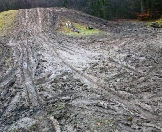 The vandalised burial mound, from Bronze Age Britain, churned up with tyre tracks shown in Wales, UK.         Source: Gwent Outdoor Centres