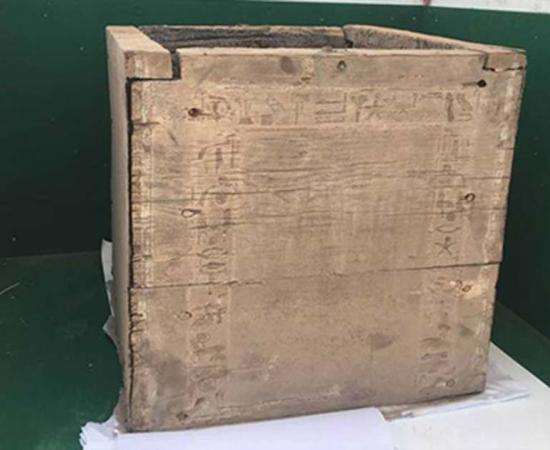 This is the 3,700-year-old box that contained the remains of the daughter of King Emnikamaw, a 13th Dynasty sovereign. You can just barely make out some of the hieroglyphics carved into the box in the photo