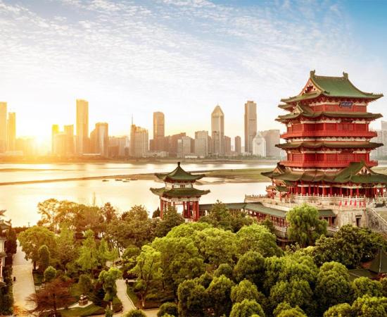 Ancient capitals of China. Representation of classic ancient Chinese architecture with a modern cityscape in the background.  Source:  gui yong nian / Adobe stock