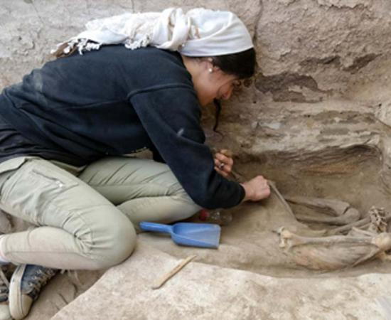 A researcher excavating an adult skeleton at the Neolithic site of Catalhoyuk in Turkey.          Source: Scott Haddow / Ohio State University