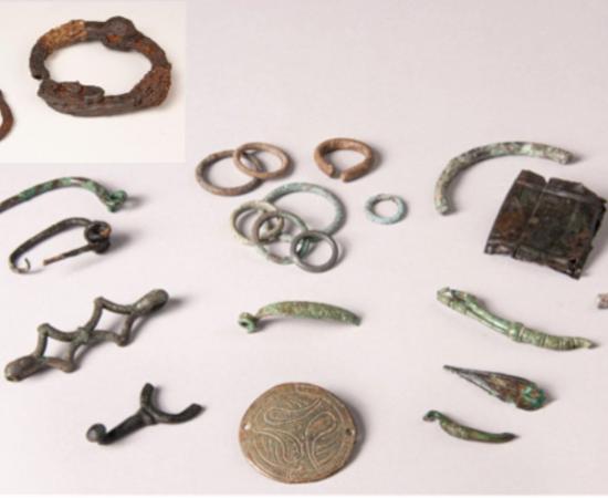 A set of small Gallic offerings and a pair of the Celtic iron shackles from Allonnes. 