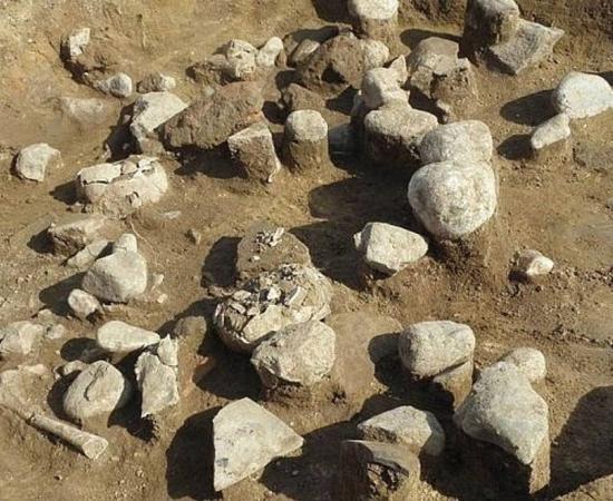 The ritual pit in which the children were crushed by stones 