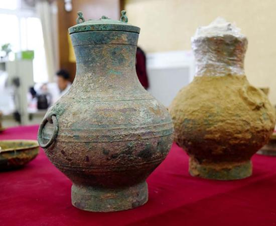 A pair of bronze pots, one containing the first real example of an ancient Chinese elixir of life, were unearthed from a Western Han Dynasty tomb in Luoyang, Henan Province.