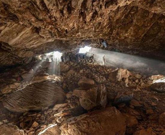 Team members entering the Chiquihuite cave, where the purported prehistoric manmade artifacts were found, which a recent study has claimed were naturally produced.		Source: Devlin A. Gandy