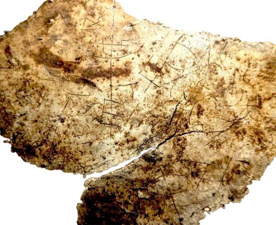 A fragment of the 5th-century chalice etched with Christian symbols, unearthed at Vindolanda in Northumberland. Credit: The Vindolanda Trust