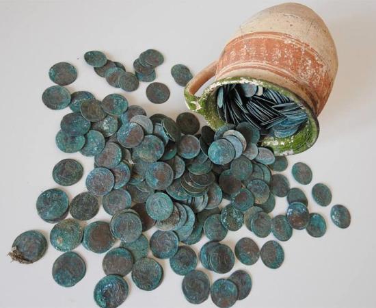Coin hoard from early 18th century stashed in ceramic mug. Source: KPÚ Košice