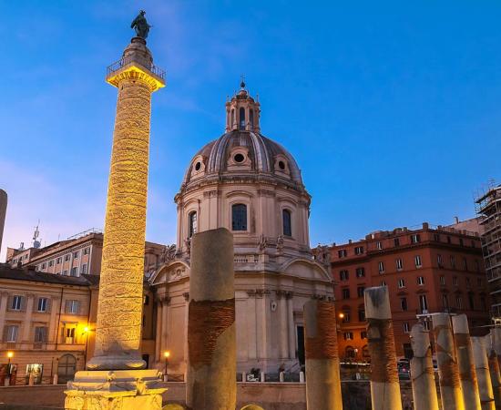 Trajan's Column and The Church of the Most Holy Name of Mary at the Trajan Forum, Rome, Italy.