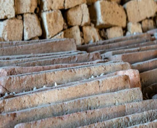 A detail of the neatly aligned ceramic roof tiles and tuff blocks in a newly excavated site in Pompeii